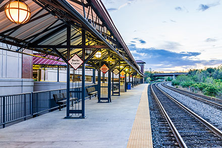a train station with a train on the tracks