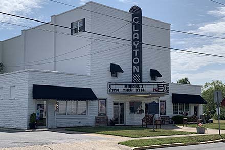 a large white building with a sign on the front of it