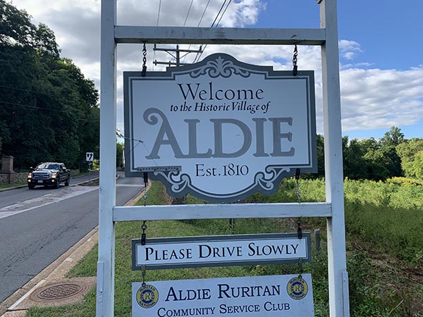 a welcome sign for the town of aldie