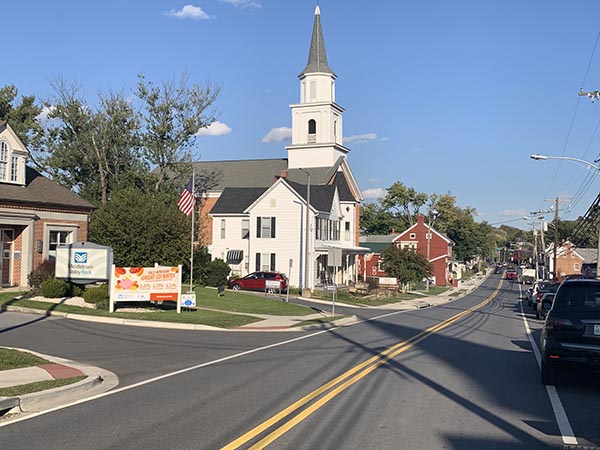 a church with a steeple on the top of it