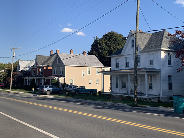 a row of houses on the side of a street
