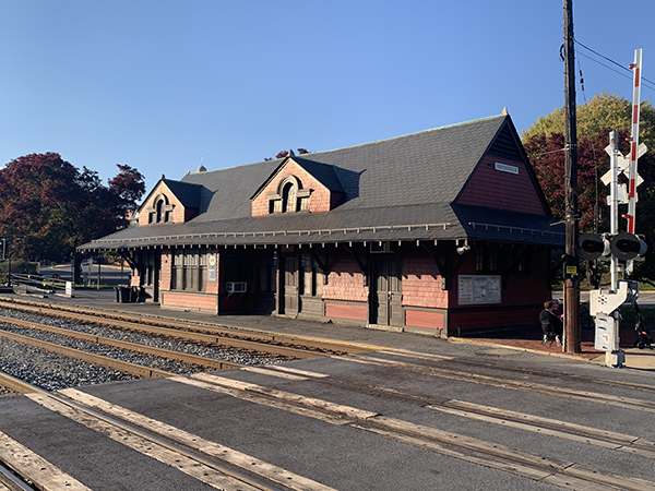 a train station with a train on the tracks